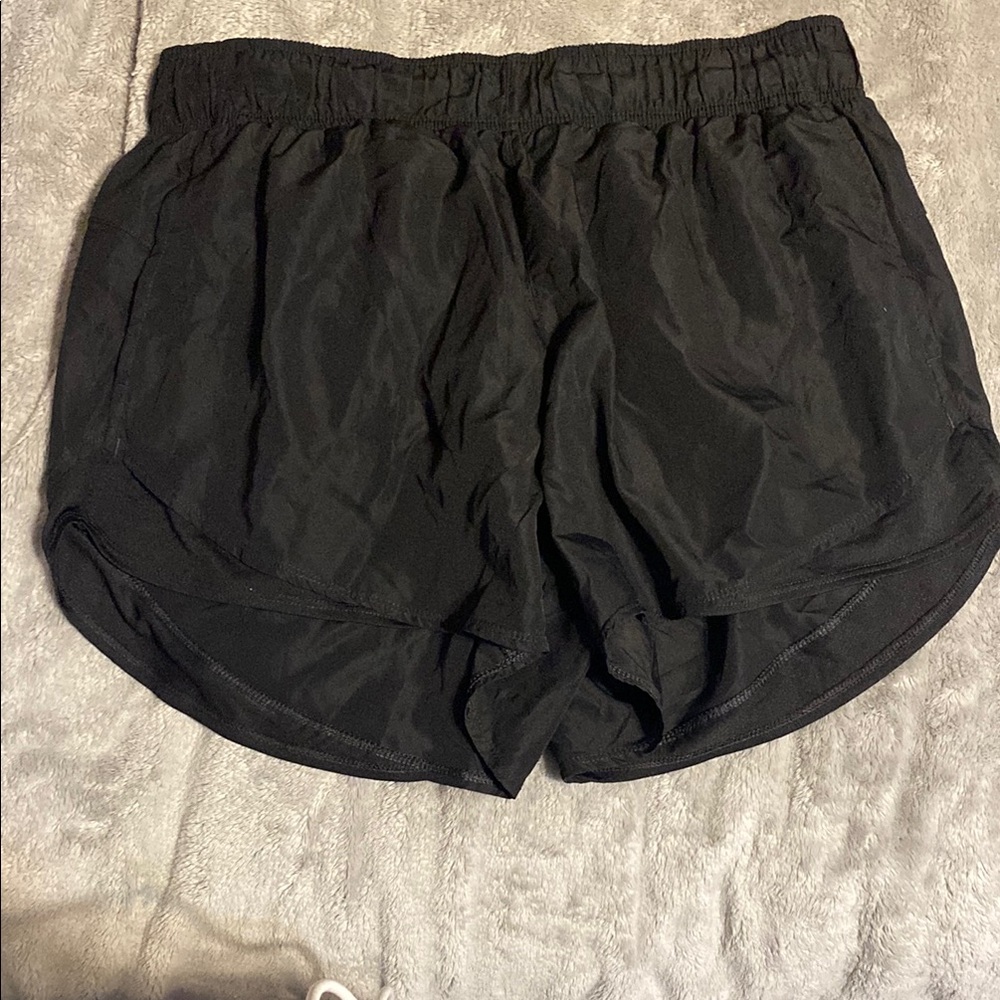 Black Athletic Shorts with Elastic Waistband and Curved Hem